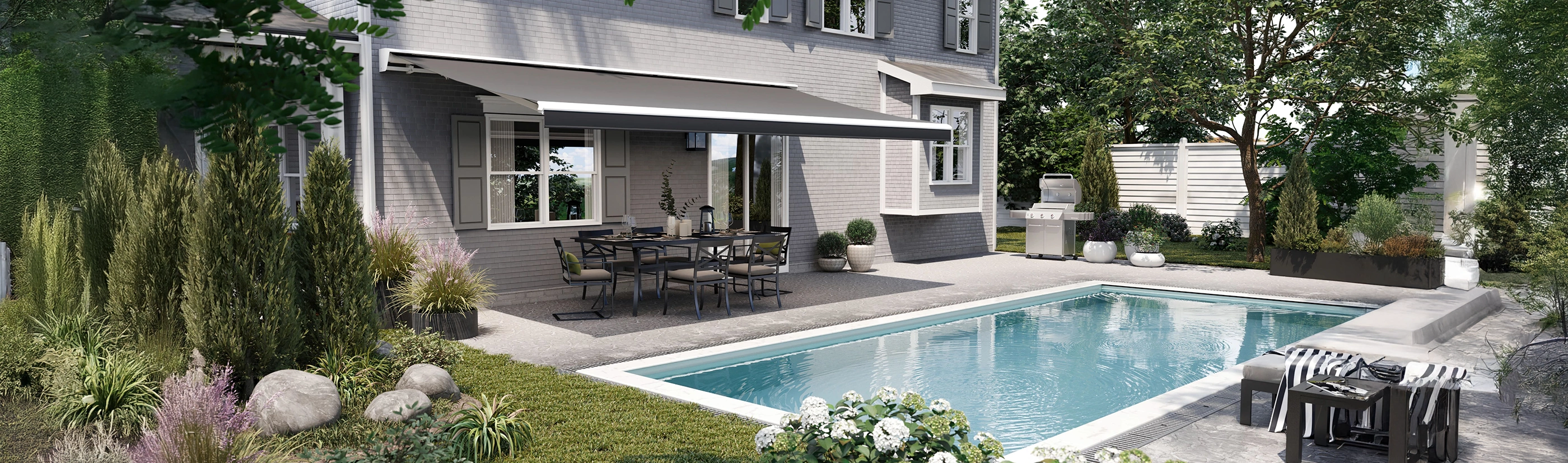 dark gray awning covering a patio with a dining table and chairs and a poolside view