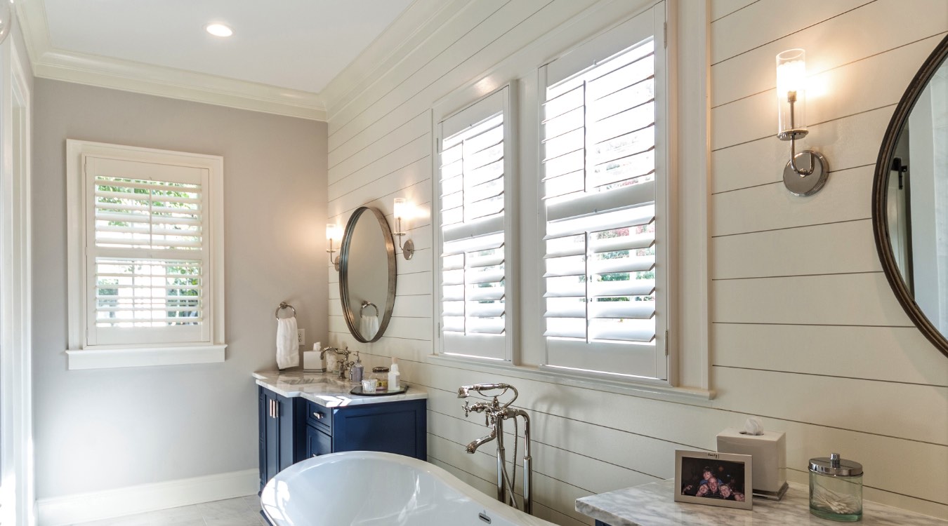 Miami bathroom with white plantation shutters.