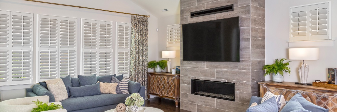Interior shutters in Coral Gables family room with fireplace