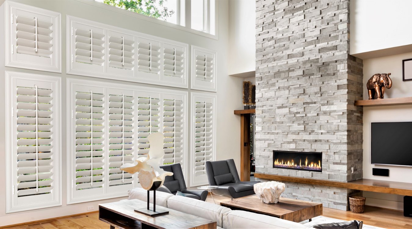 Plantation shutters by fireplace