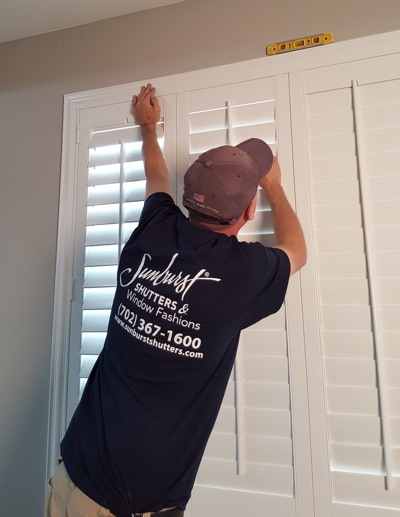 Shutter installation in Miami bedroom.