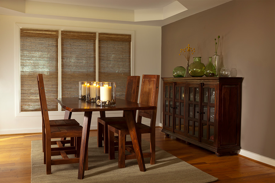 Woven brown shades in a dining room