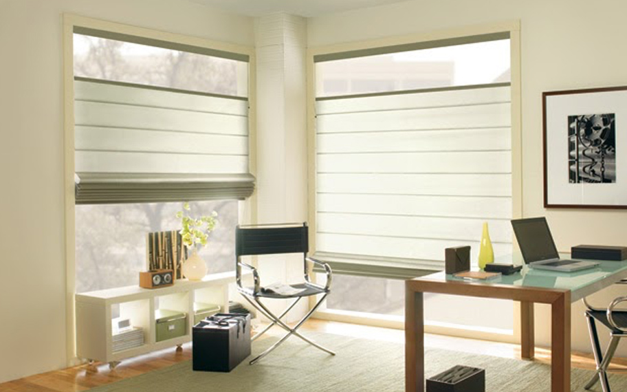 Upgrade your windows with stylish window shades or shutters in Miami. Stylish sheer shades in the corner of a modern office.