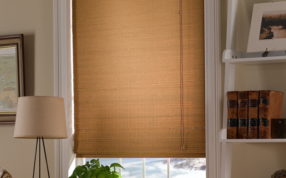 Add a touch of nature to your decor with woven fiber shades in Miami. Tan woven fiber shades in a living room
