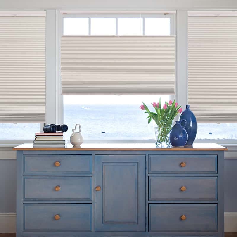 Cell shades over a dresser