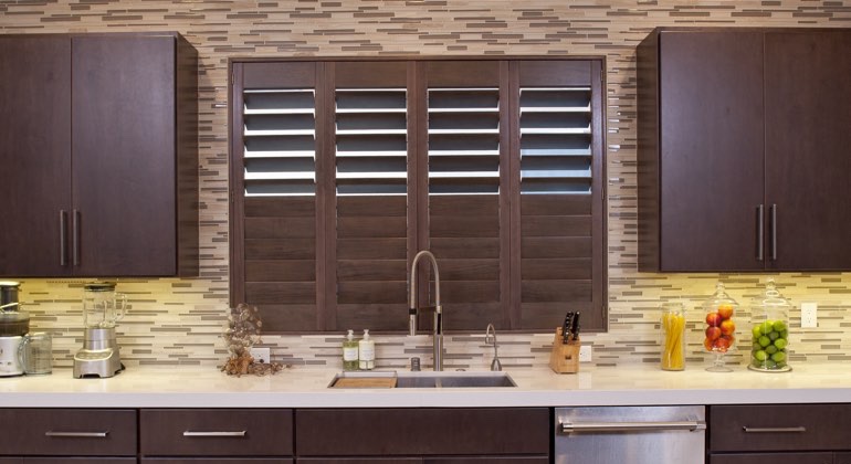 Divider rail shutters in a Miami kitchen. Miami cafe kitchen shutters