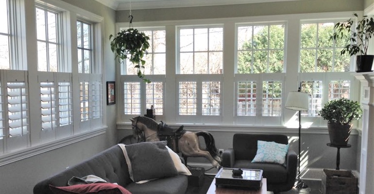 Cafe shutters in a sunroom in Miami. Miami cafe shutters living room