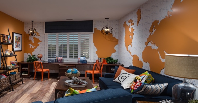 Plantation shutters are the perfect window treatment for a learning center. Family room with wall map and plantation shutters
