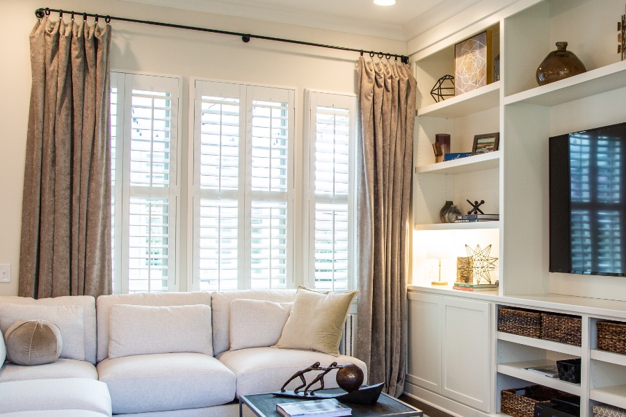Install sun-resistant Polywood shutters in Miami. Shutters in a living room