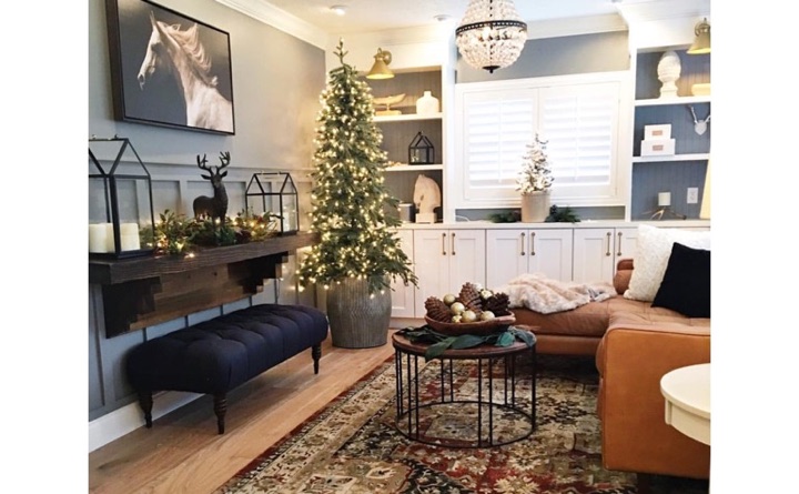 If your furniture pieces are beginning to show their age, the holidays are a wonderful time to start anew. Living room with horse painting and plantation shutters.