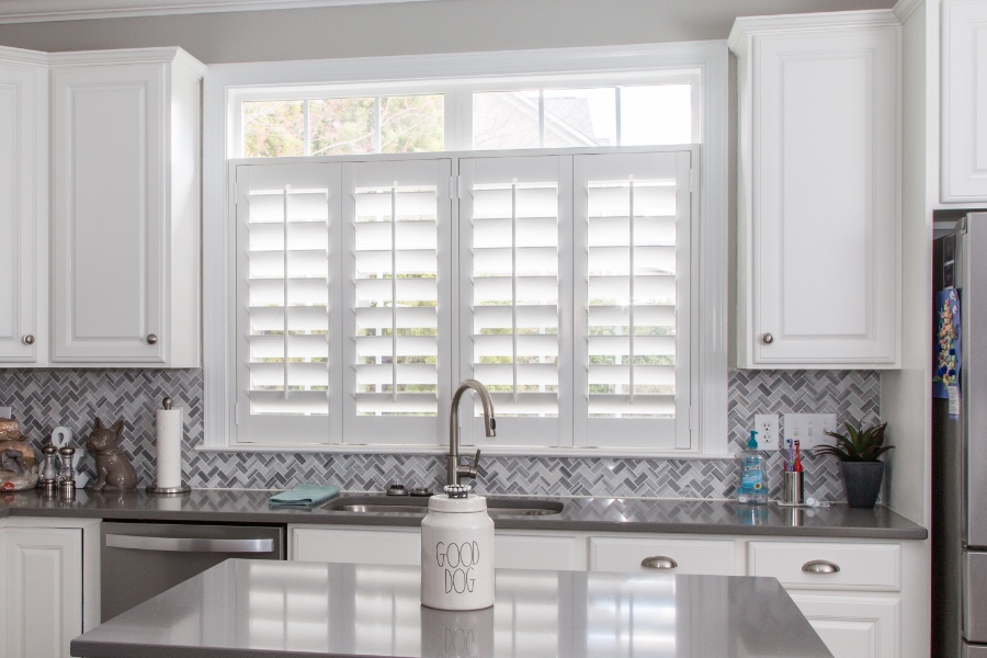 Classic Polywood interior shutters in Miami are moisture-resistant. White Polywood shutters above a kitchen sink