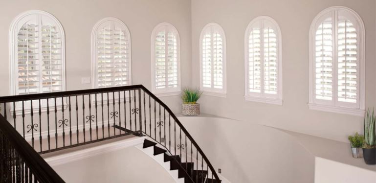 Custom-fitted window treatments completely cover your window and hang perfectly. Arched Plantation Shutters