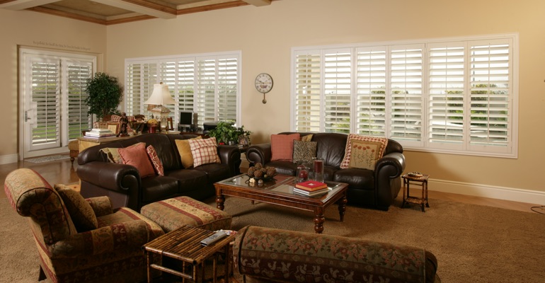 Shutters can let in as much light as you need. Miami family room with polywood shutters.