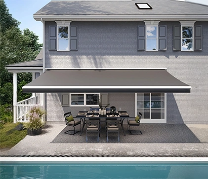 dark gray awning covering a large portion of a backyard patio and pool
