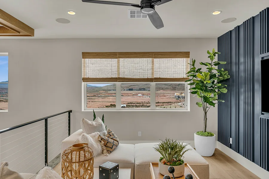 Miami homeowners who want eco-friendly home fixtures should consider natural woven shades. Natural brown woven shades on a window in a stylish sitting area