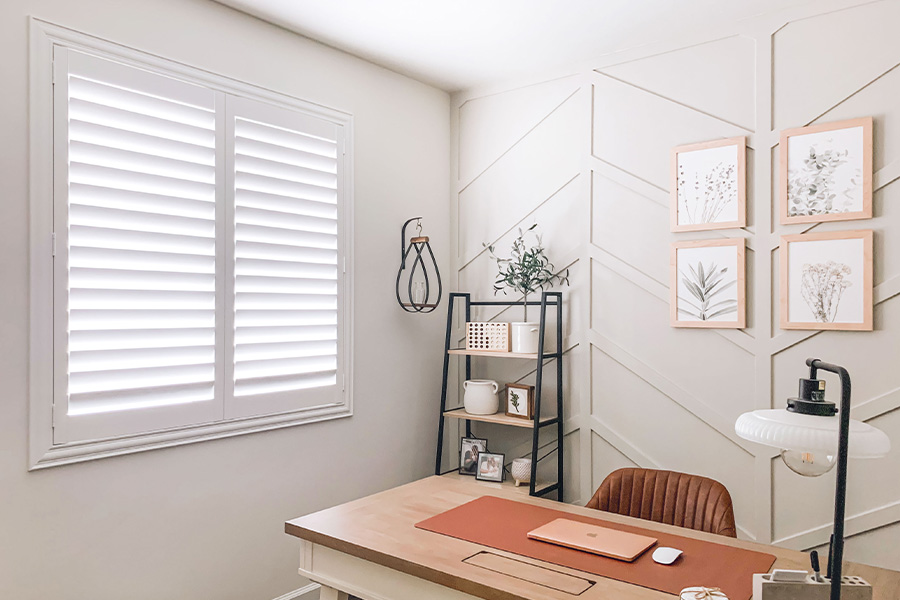 Polywood shutters give you maximum control over natural light in your Miami home. Photo Credit: @OurLakepoint Farmhouse  White and off-white farmhouse style office with natural light from polywood shutters.