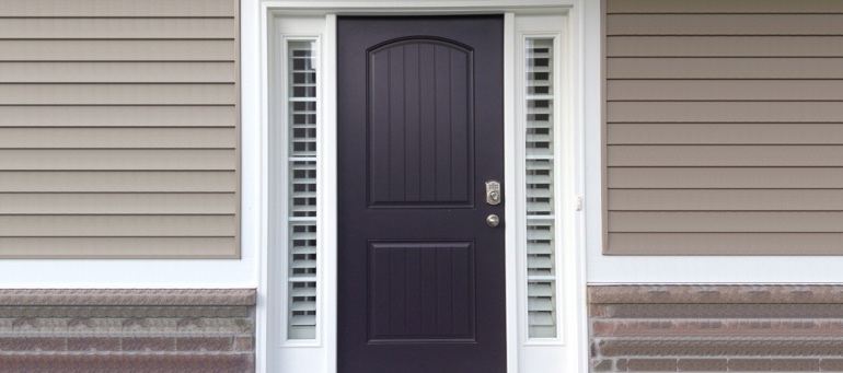 Entry Door Sidelight Shutters In Miami, FL Entry Door Sidelight Shutters Next To Black Door In Miami, FL