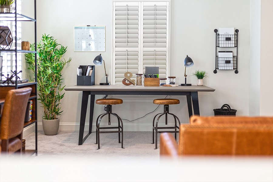 Enjoy a dramatic room transformation when you repurpose an unused room into someplace you want to be. A home office with white Polywood shutters