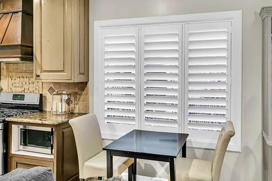 White Polywood shutters on a kitchen window